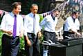 grilling . . . Graham (right), barbecues with then US President Barack Obama and Prime Minister David Cameron
