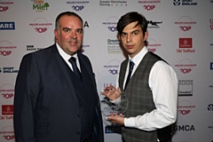 Andy Steel (right) receives his Volunteer of the Year award at Emirates Old Trafford