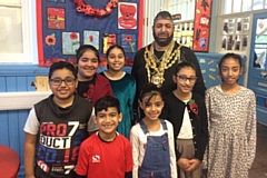 The Mayor of Oldham, dressed as Mr T, with pupils at Clarksfield Primary