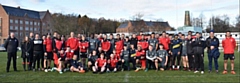 Hopwood Hall College students and Salford Red Devils staff and players line up
