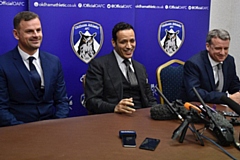 Low profile: Athletic's Moroccan owner Abdallah Lemsagam pictured (centre) at his unveiling in January. Then manager Richie Wellens (left) and then chief executive Mark Moisley were soon shown the door.