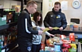 Athletic manager Richie Wellens (right) and first team coach Paul Terry took supplies to Oldham Foodbank