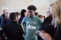 Manchester United prospect Angel Gomes meets some of the pupils at the Aon Training Complex