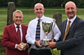 Chronicle Cup winner Andy Riley is flanked by Saddleworth captain Kevin Rafferty (left) and David Whaley