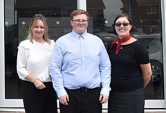 Bradley Taylor alongside his managers at RRG Peugeot Oldham