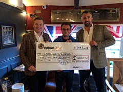 Cheque mates: Pictured (left to right) are Andrew Rothwell, chairman of Saddleworth Round Table, Adrian Green, chair of Saddleworth Village Olympics, and Matthew Sykes, Table’s community support officer