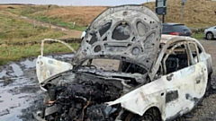 The fire-ravaged car