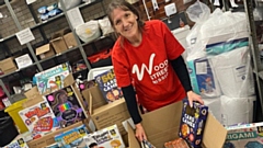 A Wood Street Mission volunteer is pictured with some of the Swansway donations