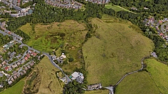 The plan is to build 265 homes and a £3.5m new link road on protected green land in Oldham.