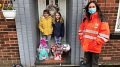 Laraine from Royal Mail in Oldham makes her special delivery to Abigail and her sister Annabel
