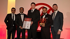 dsgnuk being presented with the Excellence in Customer Service Award by Oldham West and Royton MP, Jim McMahon.