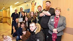 Pictured (R-L): Royal Oldham Chief Officer and Director of Nursing, Nicola Firth with Oldham College Principal Alun Francis and Fine Art students from Oldham College