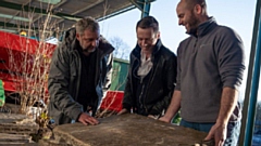 Peter Donegan (centre), Howard White, CED Stone Group, and Ed Burnham, Burnham Landscaping, inspect York stone salvaged from Oldham’s iconic Grade 2 listed Town Hall