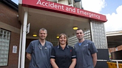Two of the Oldham A&E team are pictured with Tom Leckie (left)