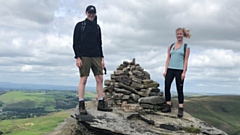 Cousins Jack Brierley and Emily Seville at the rebuilt cairn 