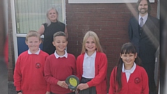 Staff and pupils at Knowsley Junior School with their award