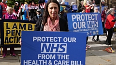 Debbie Abrahams MP attending a demonstration outside Parliament against the Health and Care Bill.