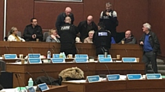 Police were called to talk to protesters at a meeting of Oldham full council