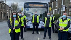 First Manchester bus and drivers get ready for funeral procession on street where Joyce Sutherland lived