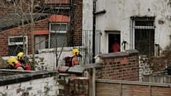 Firemen can be seen attending the property on Hollins Road yesterday