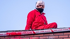 A Palestine Action protestor on the roof of Elbit's factory in Waterhead yesterday