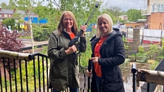 Pearson volunteers Suzanne and Dawn get stuck into the jet-washing at Maggie's