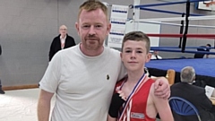Gerry McBride with his proud Dad Dan after his victory