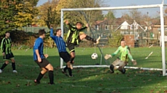 Action from the Division Two clash between Moston Brook and Aldermere