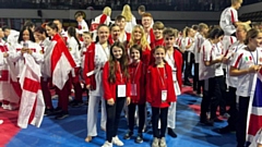 A group of proud Kenny Karate club members are pictured in Italy