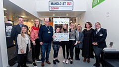 Mahdlo Youth Zone Chief Executive Lucy Lees, Chairman Chris Wareing and members Lola and Sophia with Ian Woodhead, Lindsey Milnes, Rebecca Birkbeck - Co-op Director of Community and Member Participation, Daryll Riley, Shirine Khoury-Haq– Co-op Group CEO and Rebecca Shipley from Co Op