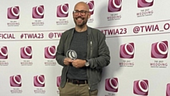 James Tracey is pictured with his award