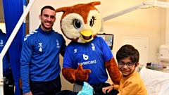 Latics ace Liam Hogan and Chaddy the Owl pictured during their visit to the hospital. Images courtesy of OAFC
