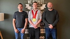 Joseph Brooks, Graphic Design apprentice, pictured at his employers - Rhino Group - celebrating his success at WorldSkills UK 2022. Left to right are: Lee Morris, Senior Creative, Rhino Group, Joseph, and Steve Phillips, Senior Creative, Rhino Group