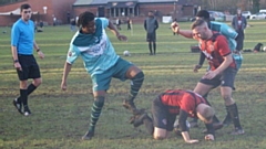 Where's the ball gone?: Action from the AFC Oldham (light green shirts) versus Didsbury clash