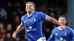 Hallam Hope celebrates scoring Latics' first goal of the game