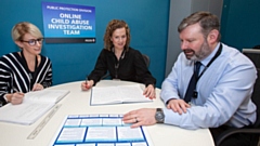 Officers from the Online Abuse Investigation Department 