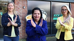 Linda Ormrod, Dr Anita Sharma, Courtney Ormrod adopting the International Women's Day Cross pose. 