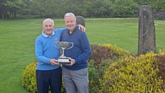 LOCAL LEGENDS: Great friends and fierce rivals Les Lawton and Alan Squires with the District Championship trophy they have done battle over many times.