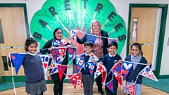 Councillor Chadderton with children from Bare Trees Primary School and their bunting