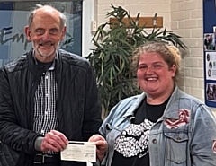 Pictured accepting the cheque from Saddleworth Rotary President Ian Brett at the Youth Club is YOLO Treasurer Amy Wrigley.
