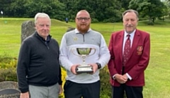 Adam Rowbotham is flanked by Alan Squires (left) and Saddleworth captain Dave Newman