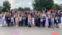 Cllr Eddie Moores pictured with children during a summer HAF event