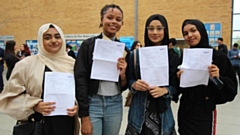 Radclyffe School students are pictured celebrating their achievements