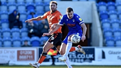 Striker Hallam Hope (left) pictured in action for Latics. Image courtesy of OAFC