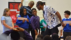 Sir Lenny Henry creating a story with Year 4 children from Oldham