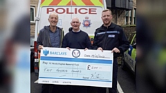 Pictured presenting the cheque to Bryn Hughes (centre) is Saddleworth Show Committee member Clint Elliott and NPT Sergeant Connor Brook