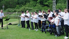Pennine Mencap's very own Rhodes Bank Choir are pictured performing at this year's Saddleworth Show