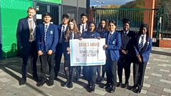 Pictured are Waterhead Academy students celebrating achieving the prestigious bronze award in the UK Social Mobility Awards, within the School/College of the Year category, along with Head of Year 7 Steve Hardy