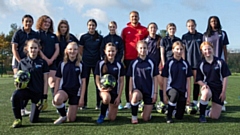 Former Manchester United and England star Wes Brown is pictured with Royton and Crompton students