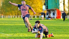 Get in there: James Perks goes over for an Oldham try